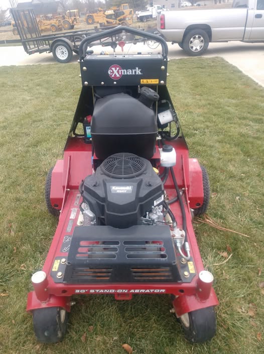 ExMark stand-on core aerator used by The Lawn Guy